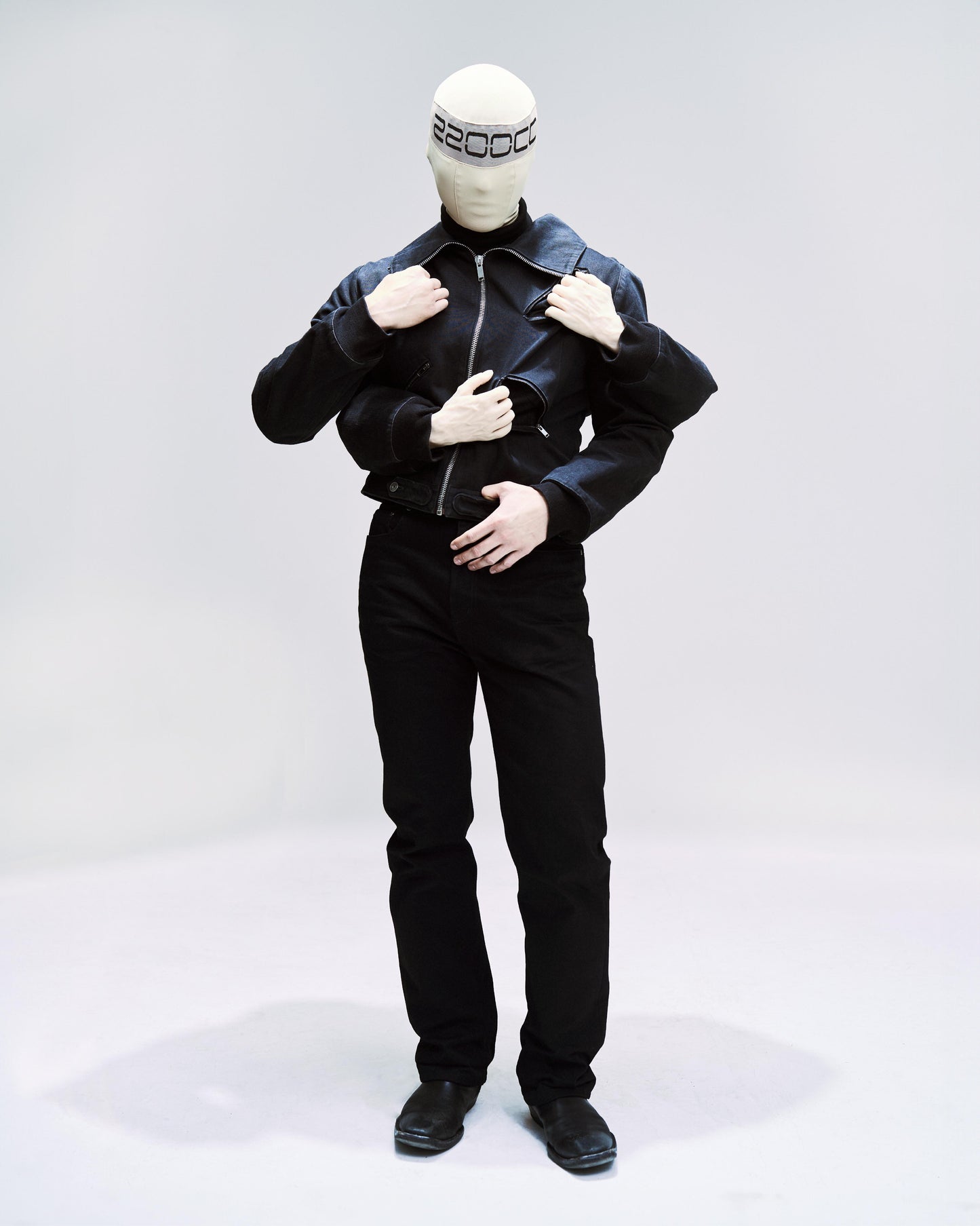 avante garde jacket with four arm sleeves, and 2 posable hands and four diagonal zippers