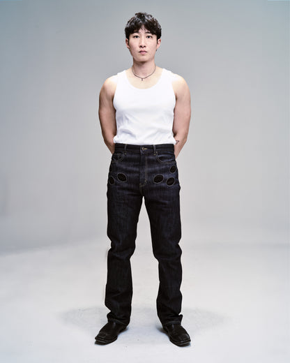 Blue denim straight leg jeans with 6 circular pockets.