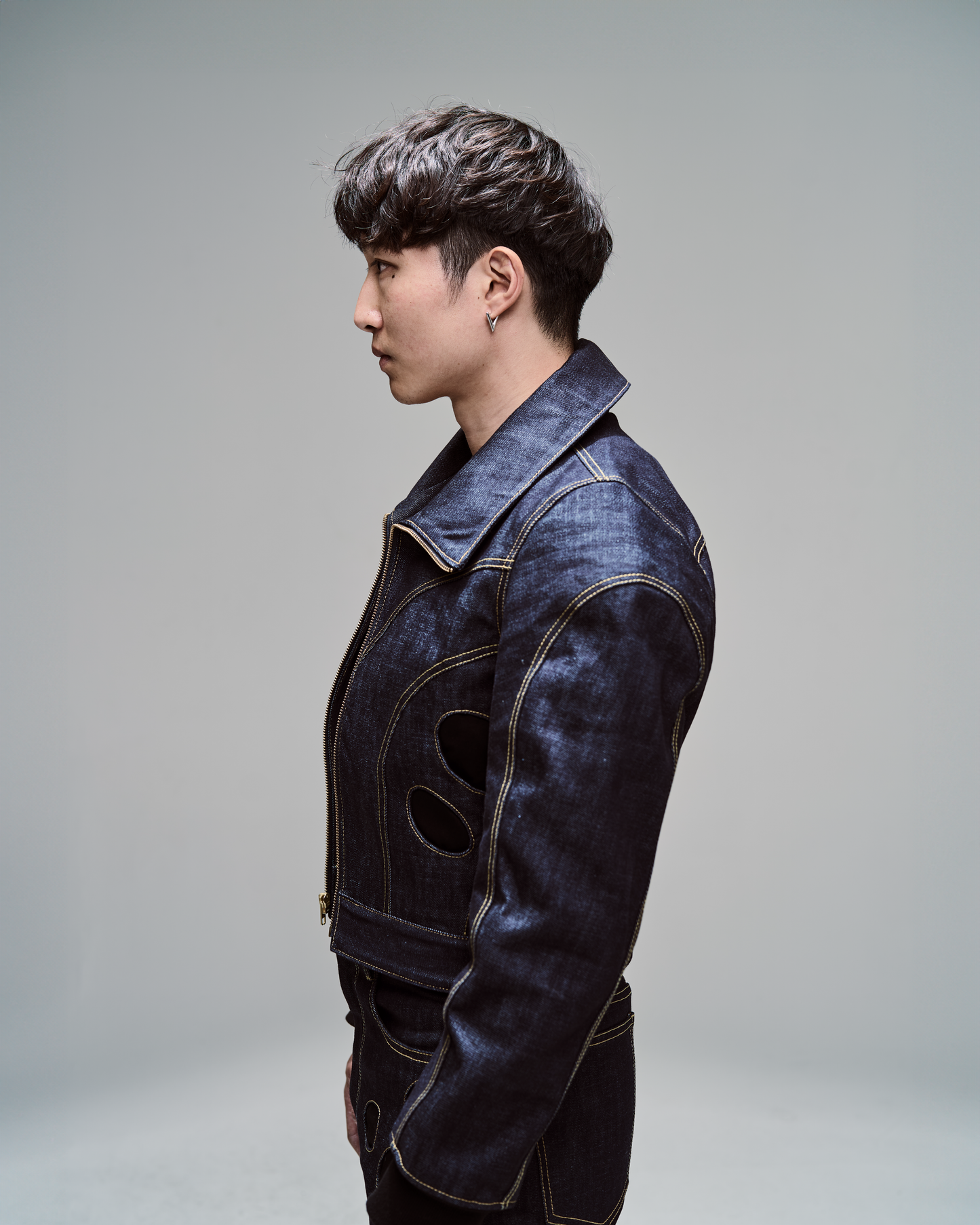 2200CC blue denim jacket with circular pockets and hand sewn detailing.  Innovative, avant garde menswear.